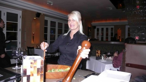 Our waitress, serving up our Caesar salad